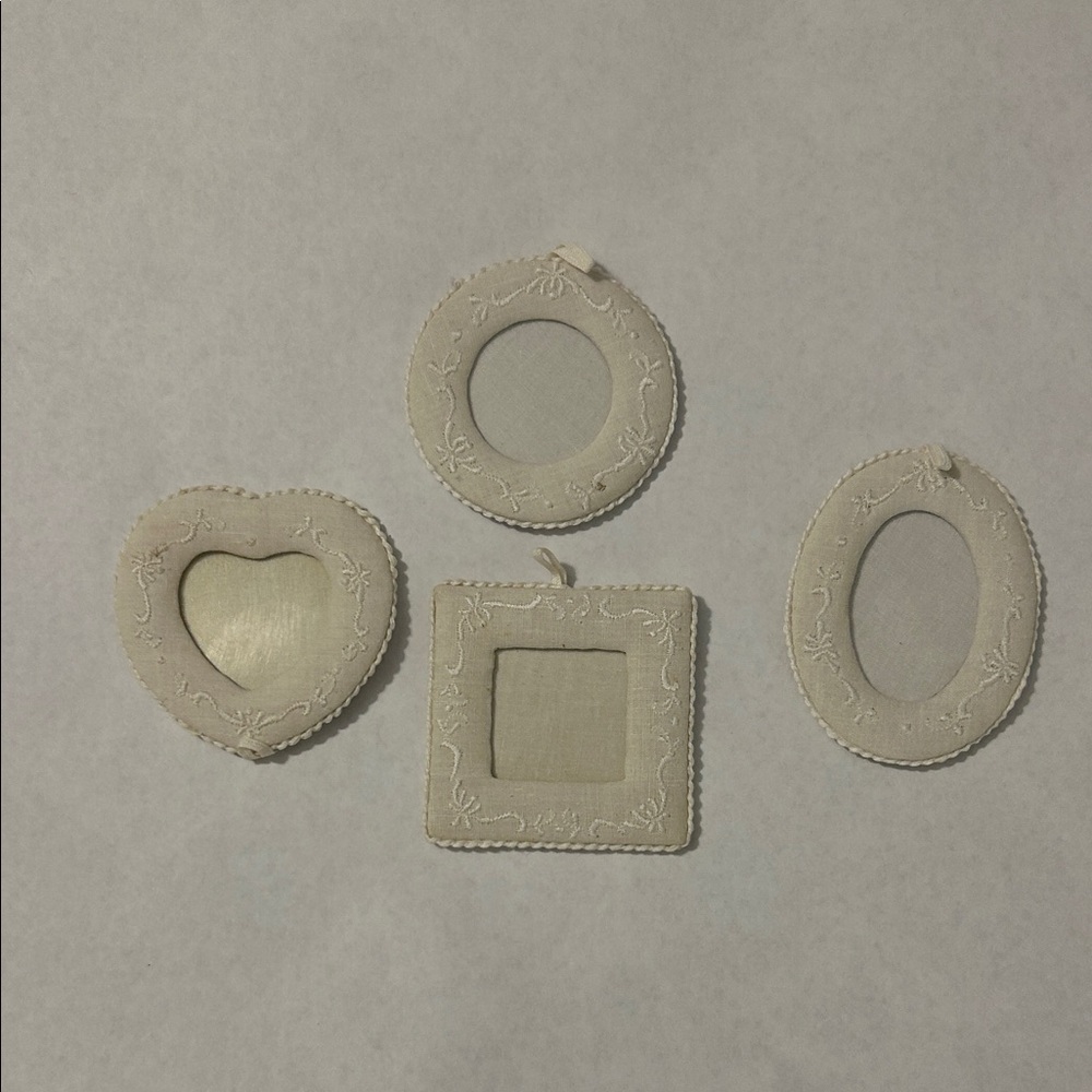 Set of 4 antique white linen color photo frames.